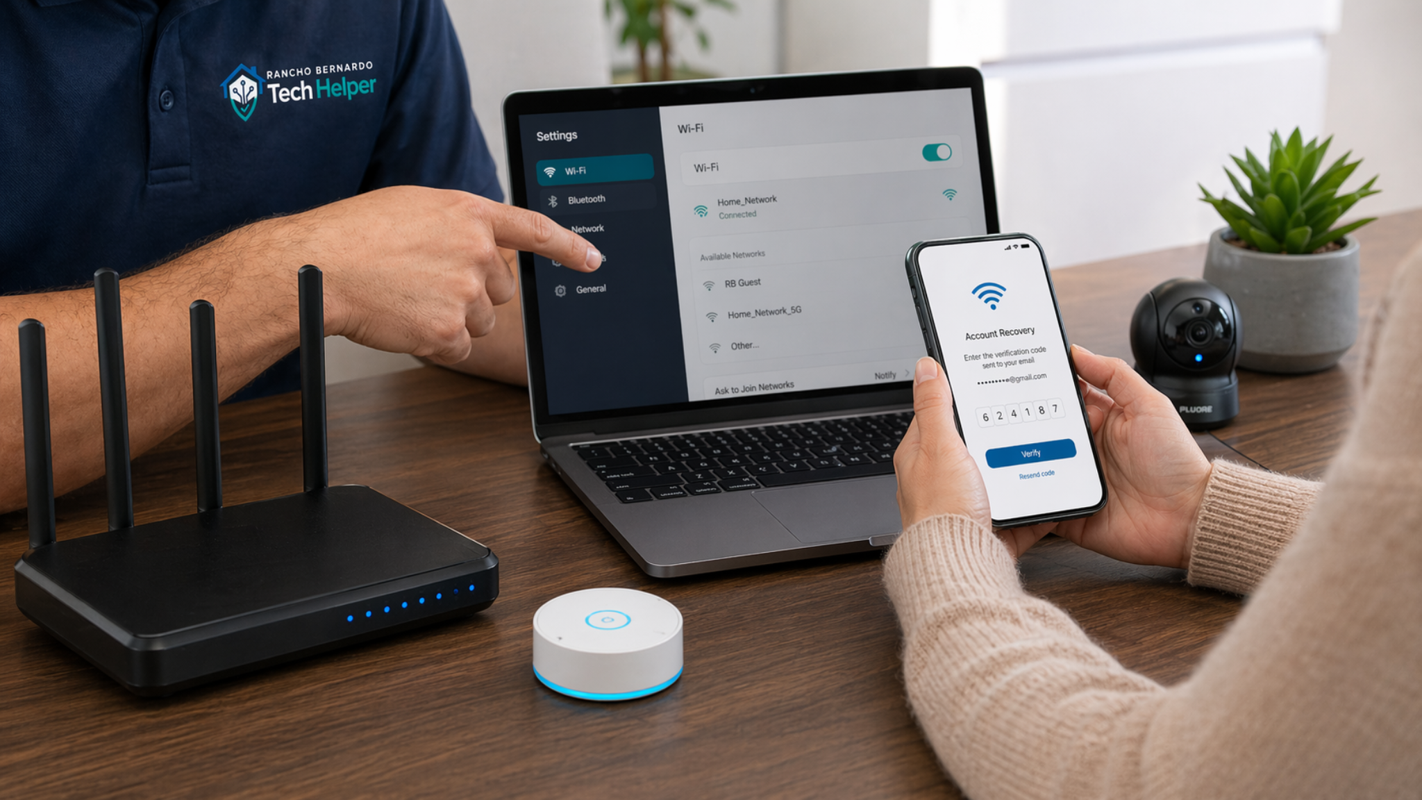 In-home tech support visit with laptop, phone, and Wi-Fi setup